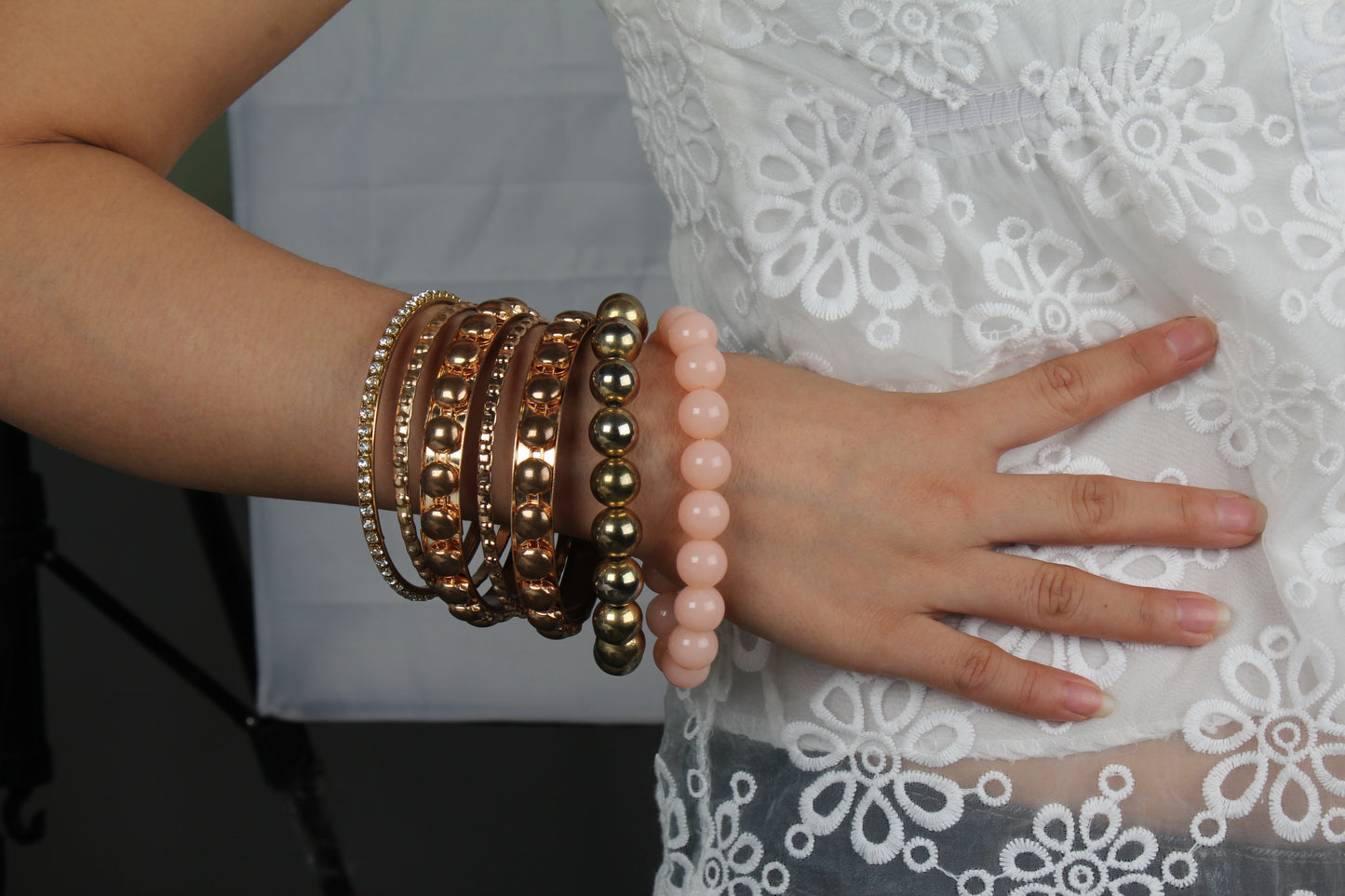 Gold stacked bangle bracelet set, 7-piece, by Solenne, styled