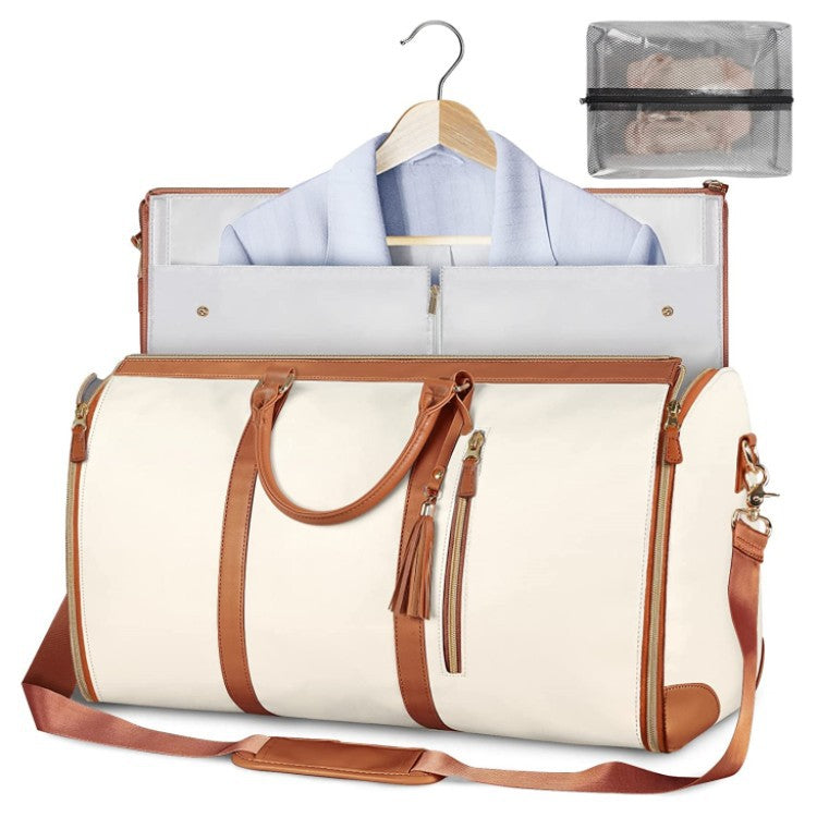 Weekender travel duffle bag styled with neutral travel essentials.