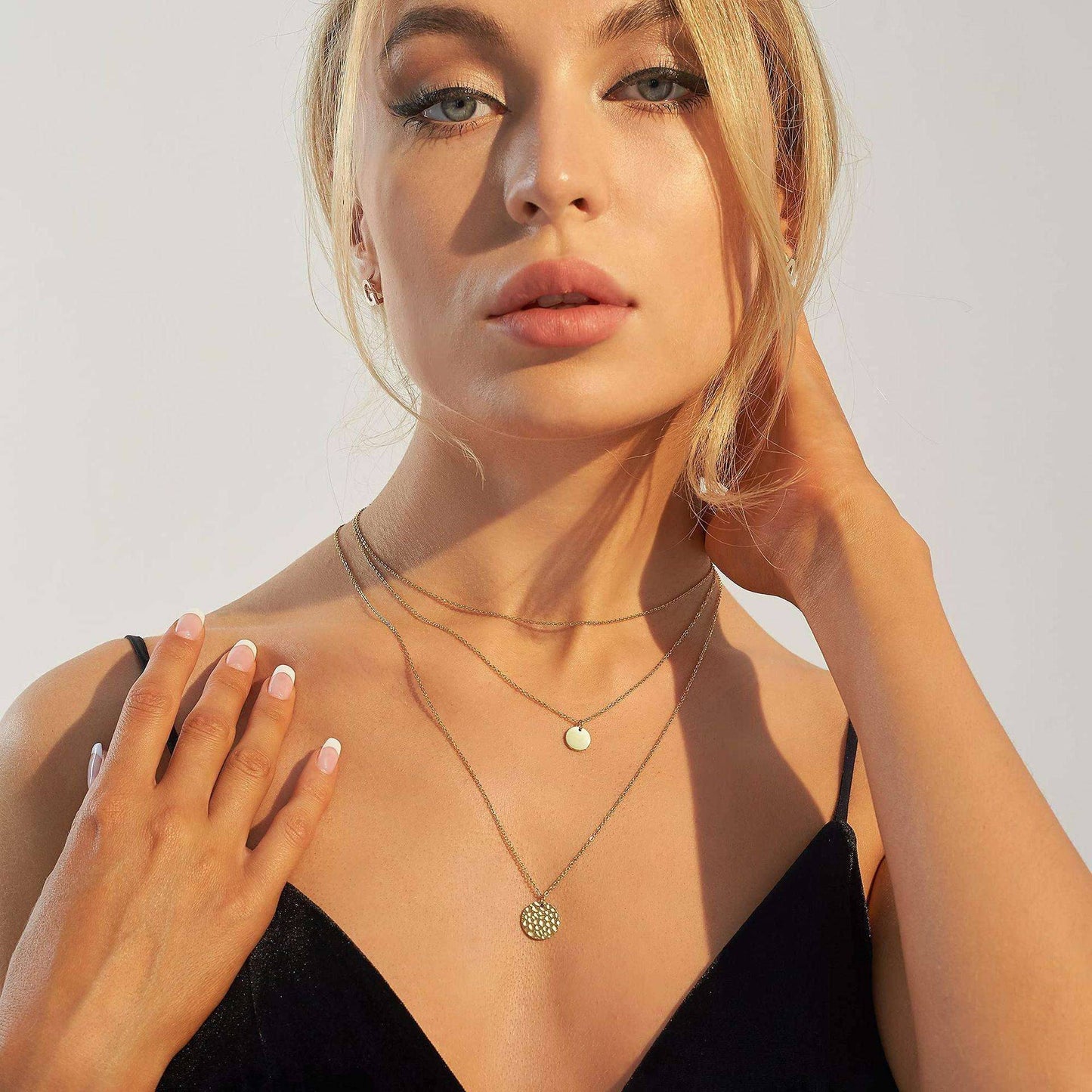 14K gold-plated layered choker necklace by Solenne, worn on the neck