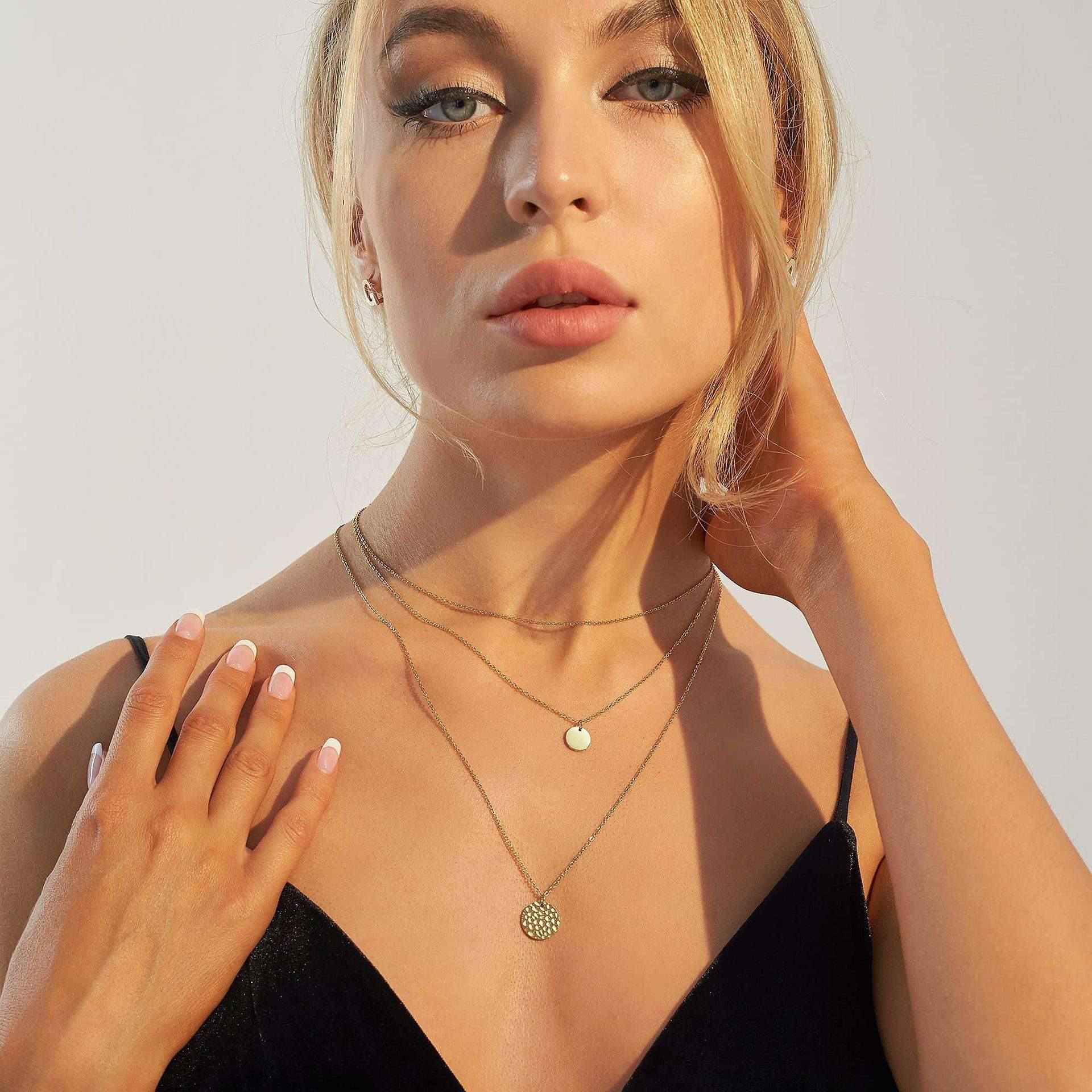 14K gold-plated layered choker necklace by Solenne, worn on the neck
