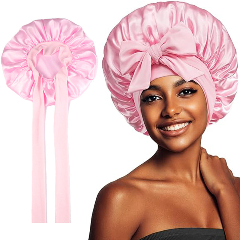 Satin bow sleep bonnet by Solenne, detail