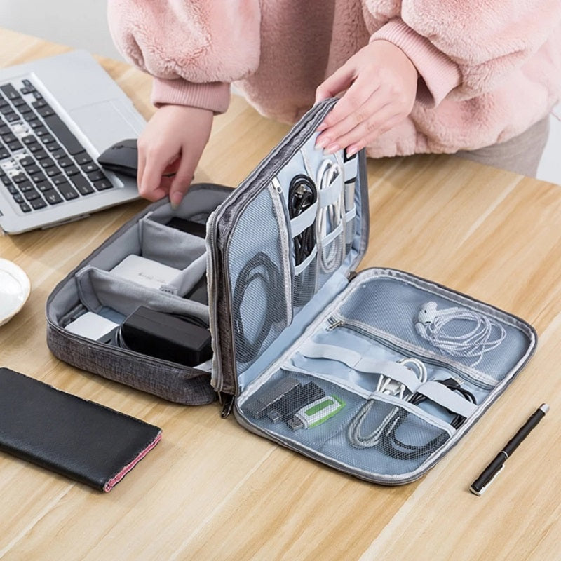 Tech and cable travel organizer by Solenne, in hand