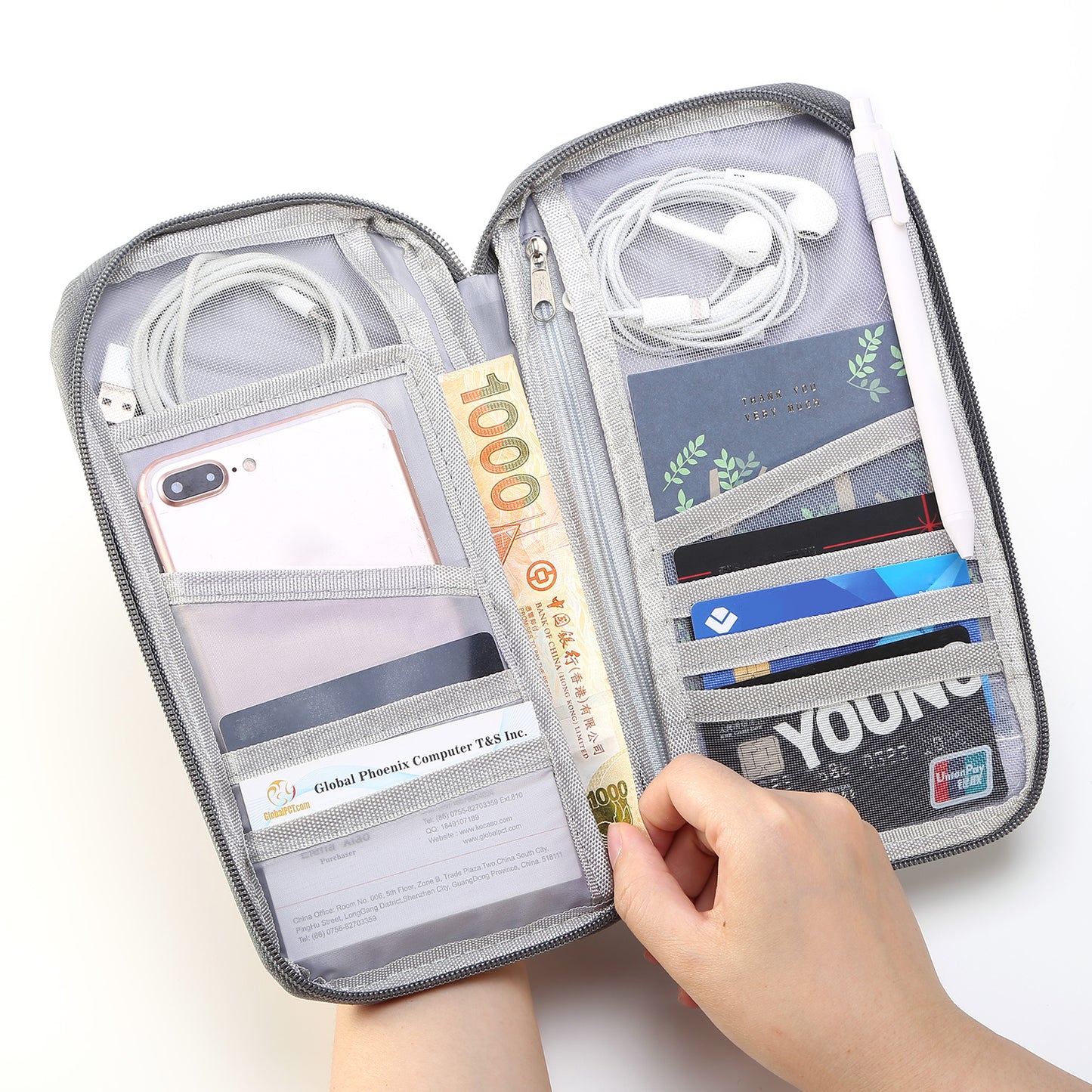 Travel passport and document wallet by Solenne, open with cards