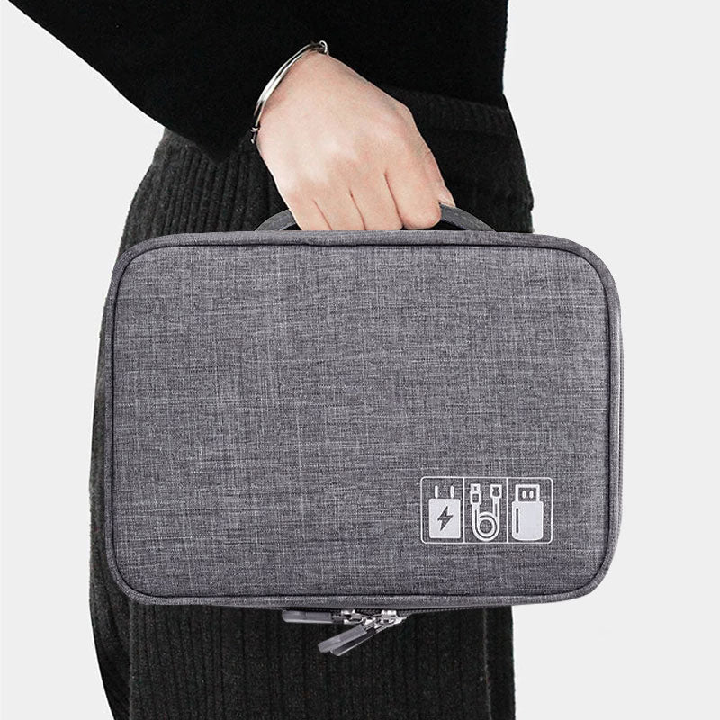 Tech and cable travel organizer by Solenne, holding tech accessories