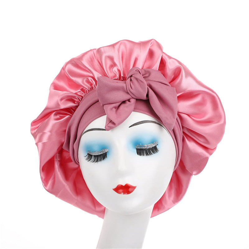 Satin bow sleep bonnet by Solenne, close-up of bow