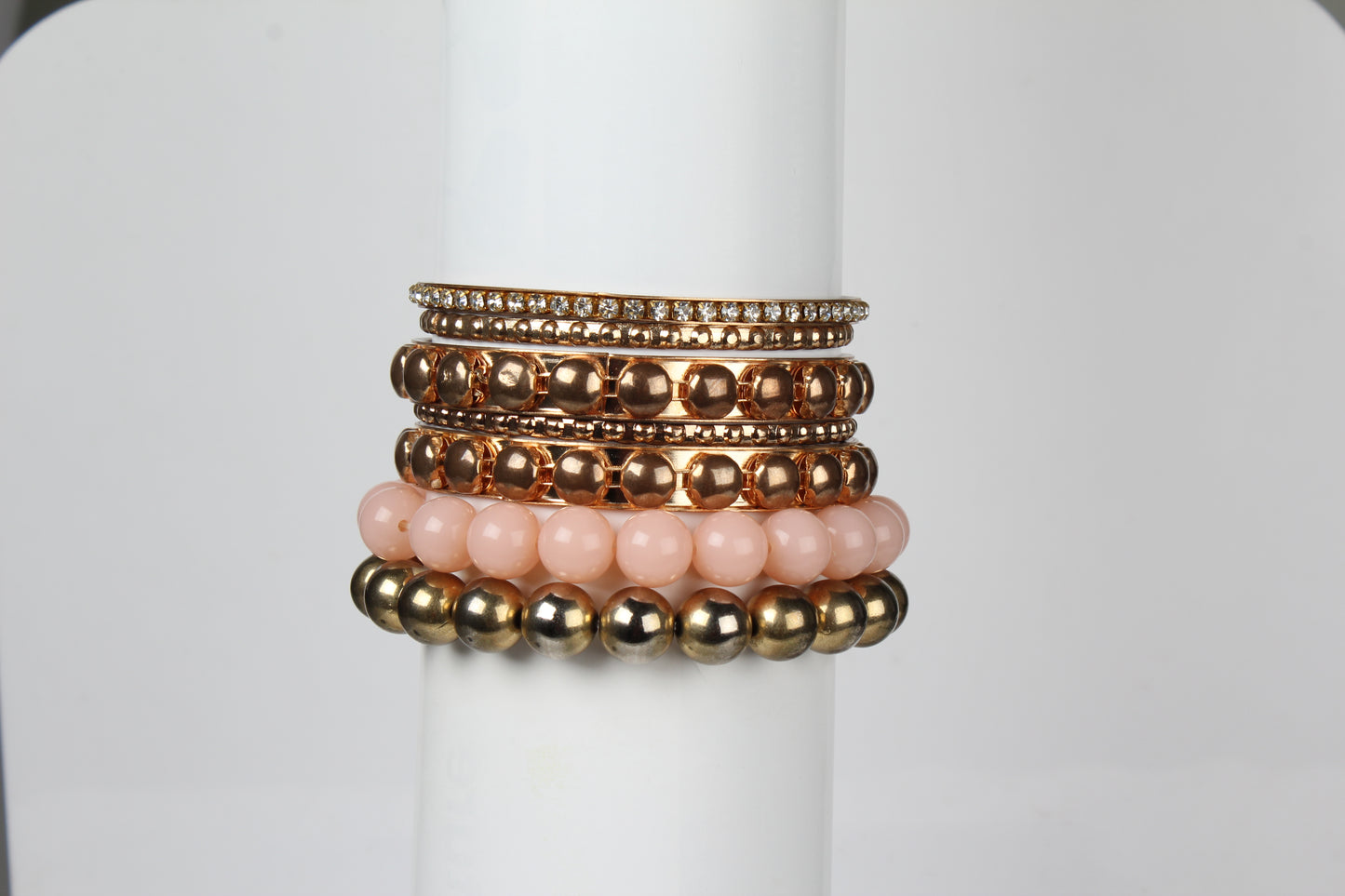 Gold stacked bangle bracelet set, 7-piece, by Solenne, stacked on the wrist