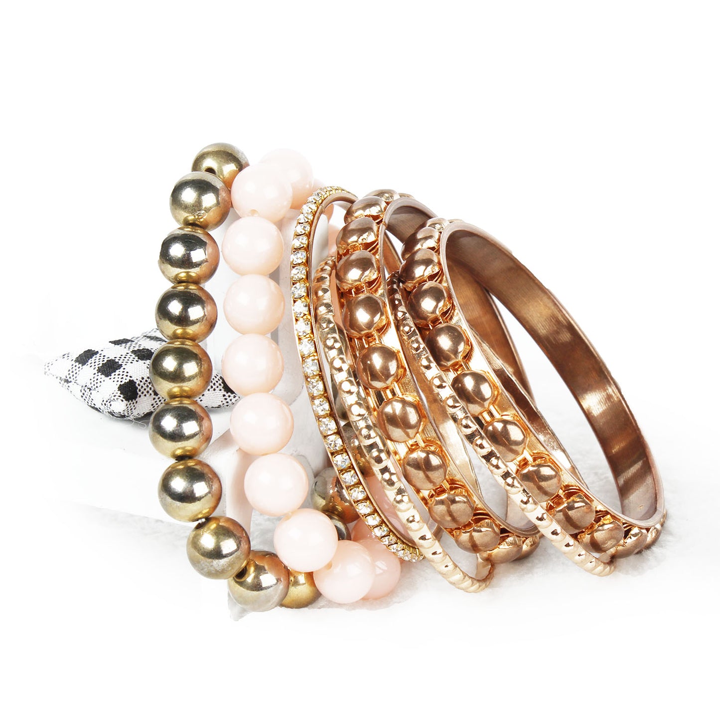 Gold stacked bangle bracelet set, 7-piece, by Solenne, close-up