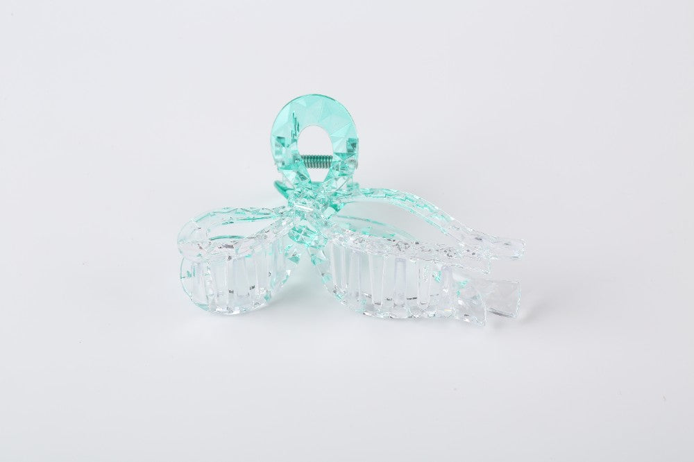 XL claw hair clip set by Solenne, held in hand