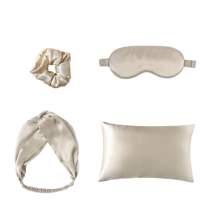 Satin scrunchie and sleep accessory set styled for a soft night routine.