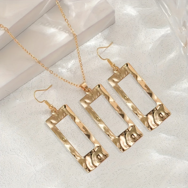 Gold hammered necklace and earrings set by Solenne, alternate angle