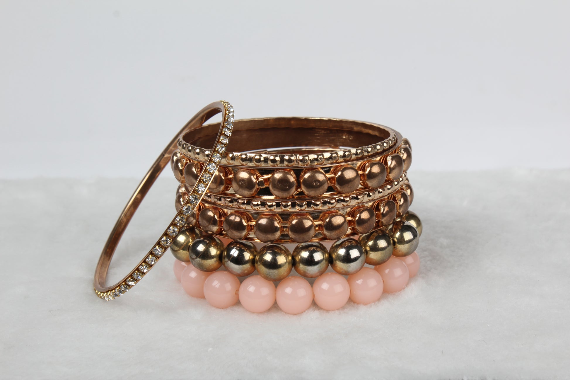 Gold stacked bangle bracelet set, 7-piece, by Solenne, full set laid out